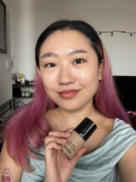 Image may contain Bottle Cosmetics Perfume Hair Person and Pink Hair